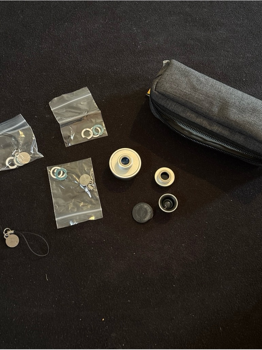 Gray Portable Lens Kit Pouch with Silver Camera Lenses